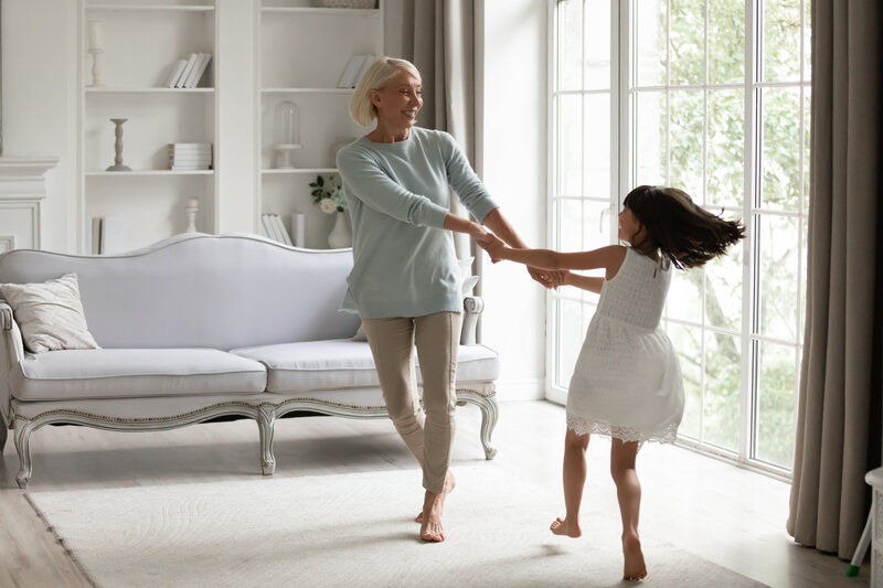 a nanny dances with a child