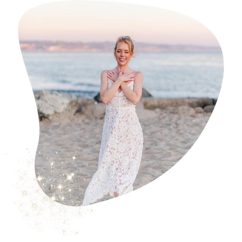 Woman in white lace dress on beach