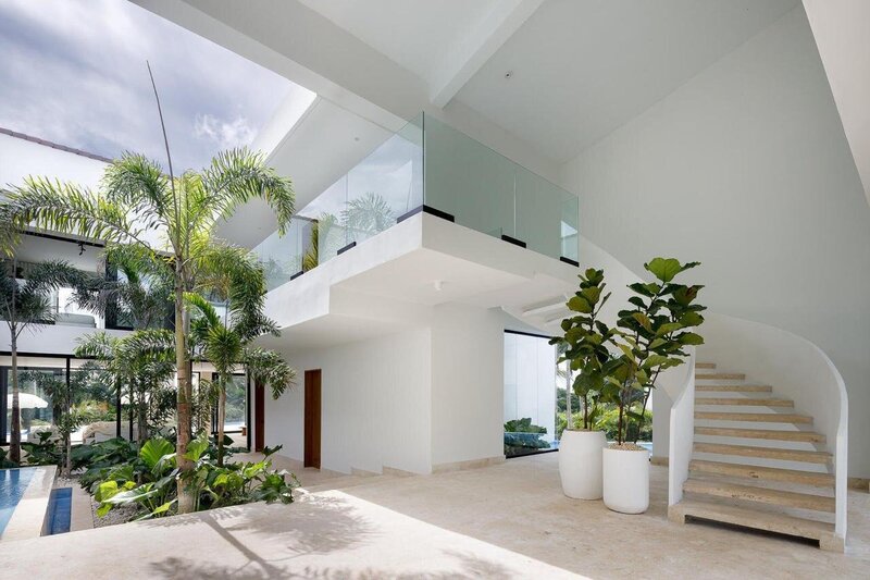 Bright kitchen with white cabinets, tile backsplash, and natural décor elements reflecting Feng Shui