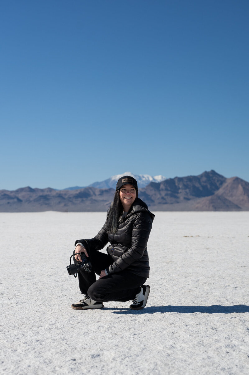 Photo of Parsell Photography owner, Rachel Parsell, smiling and holding camera