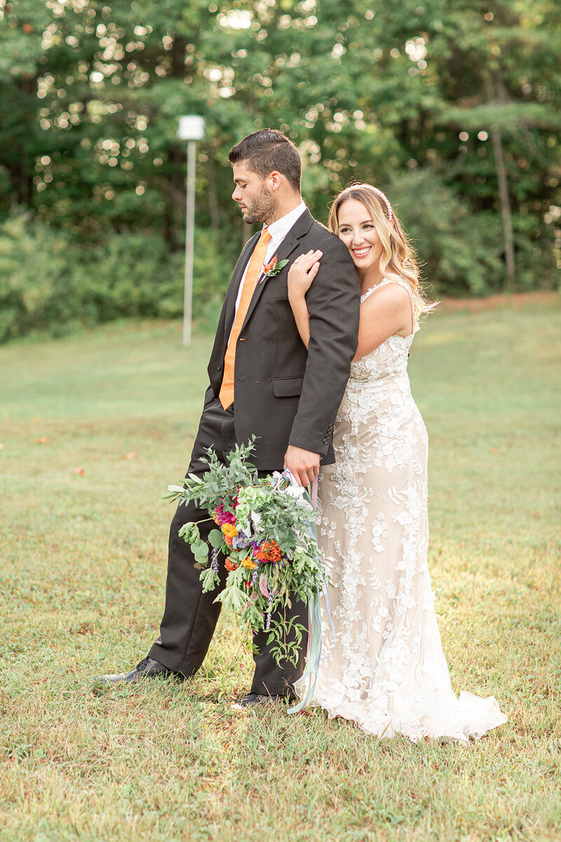 Bride and groom looking at camera