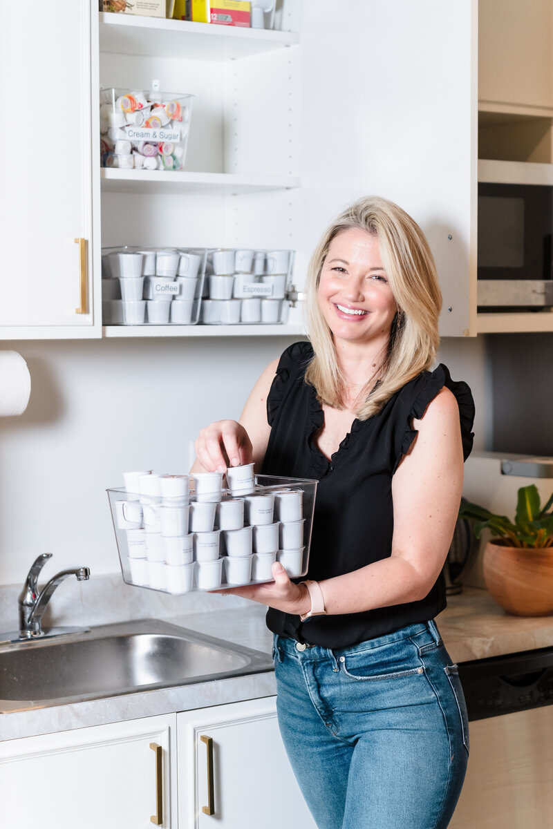 woman organizing coffee capsules