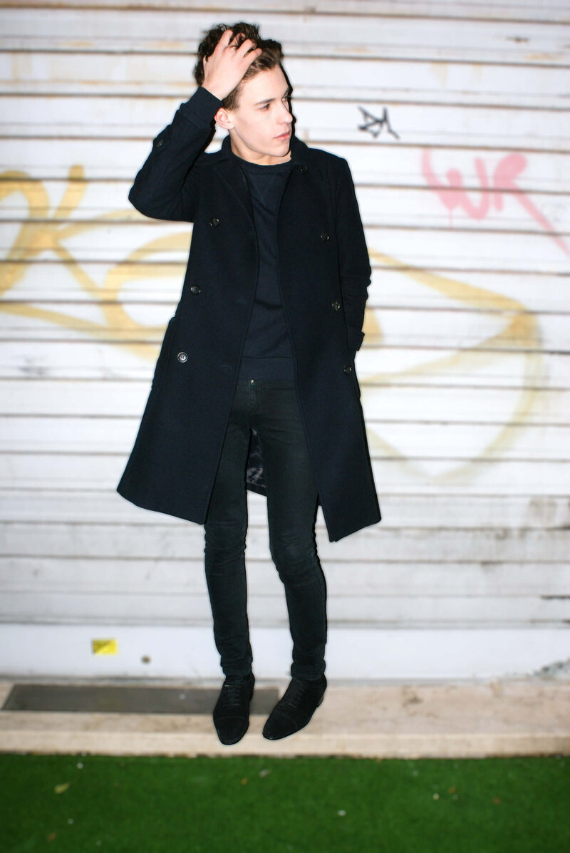 Personal Branding Image of a guy in black clothes posing like a model