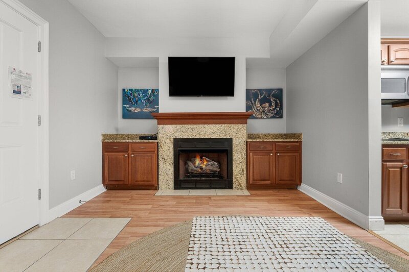 fireplace with tv above mantle