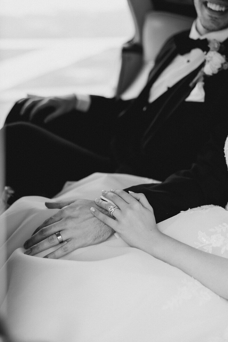 bride and groom in vintage car together