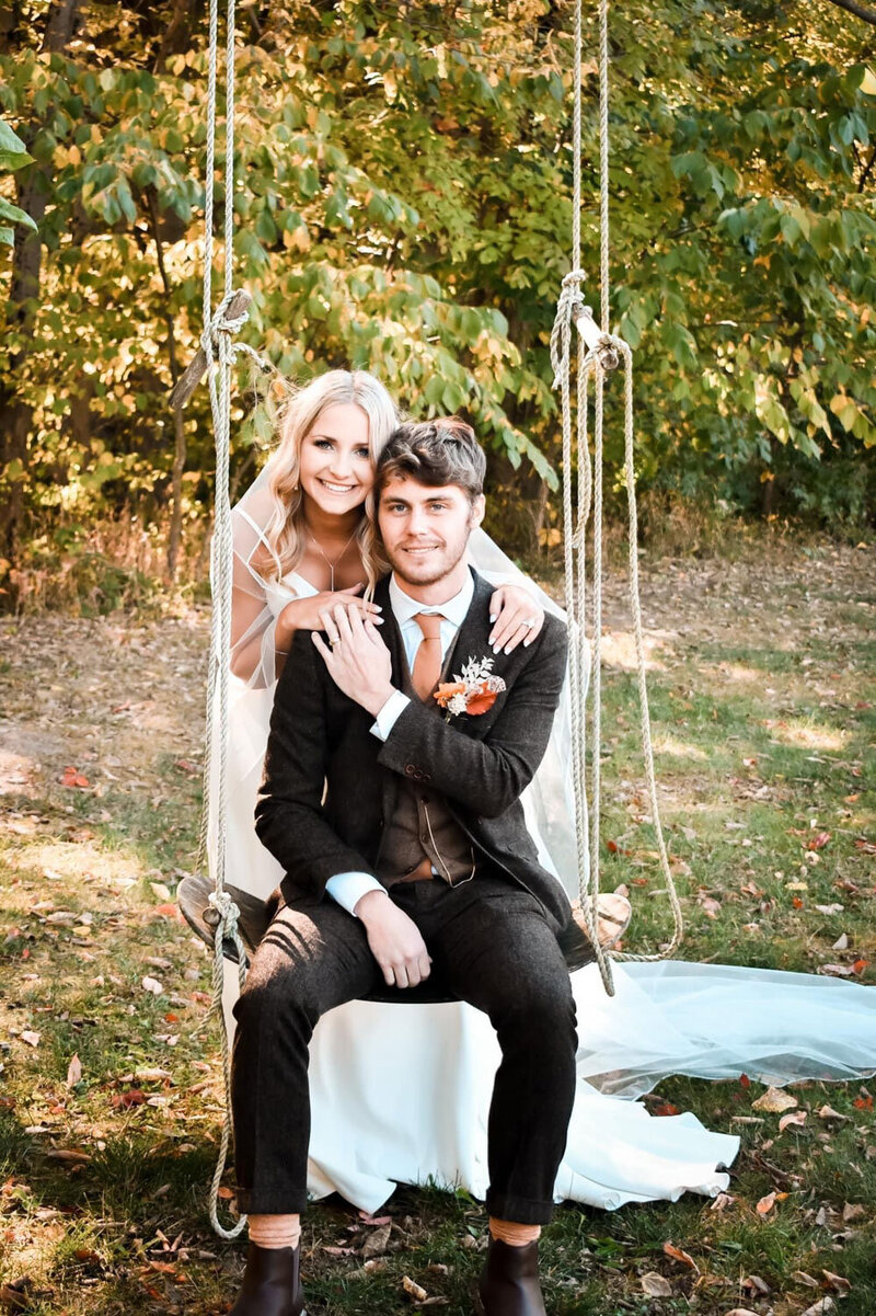 Bride leaning to the groom swinging