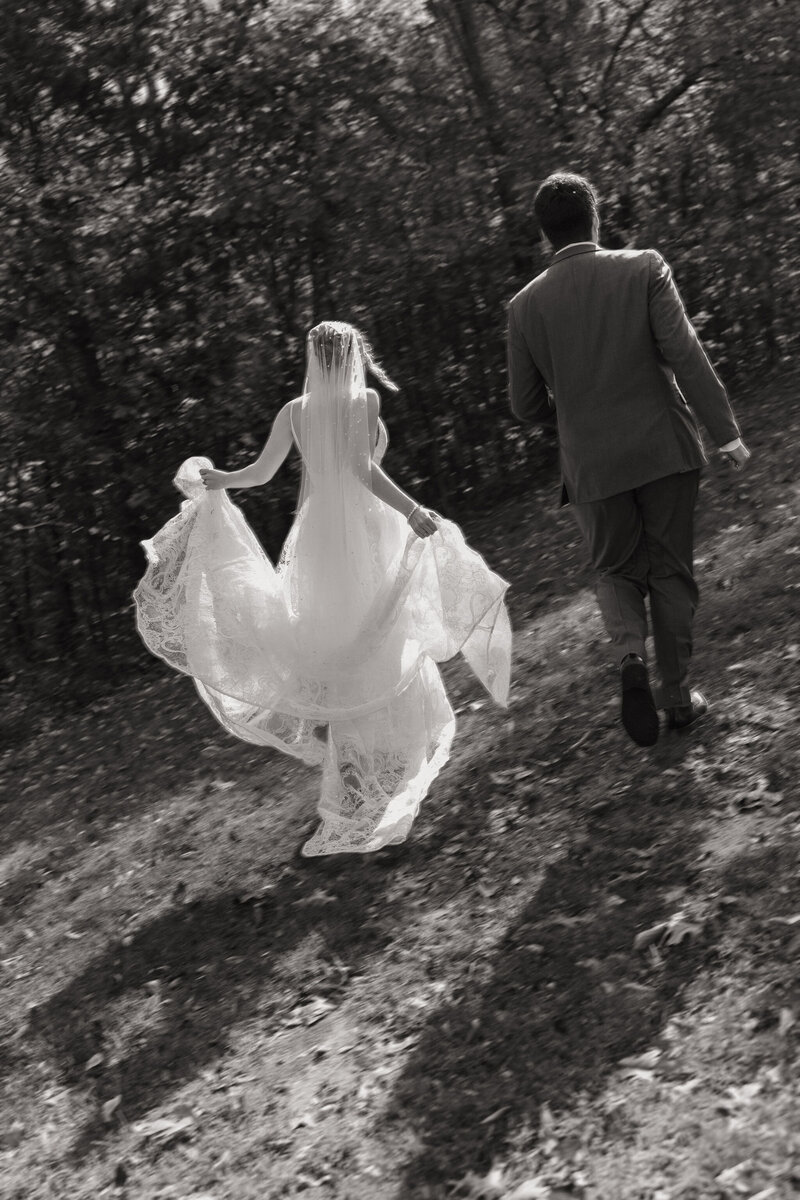 A bride and groom embrace during their first look before their wedding ceremony. The groom is moved to tears.