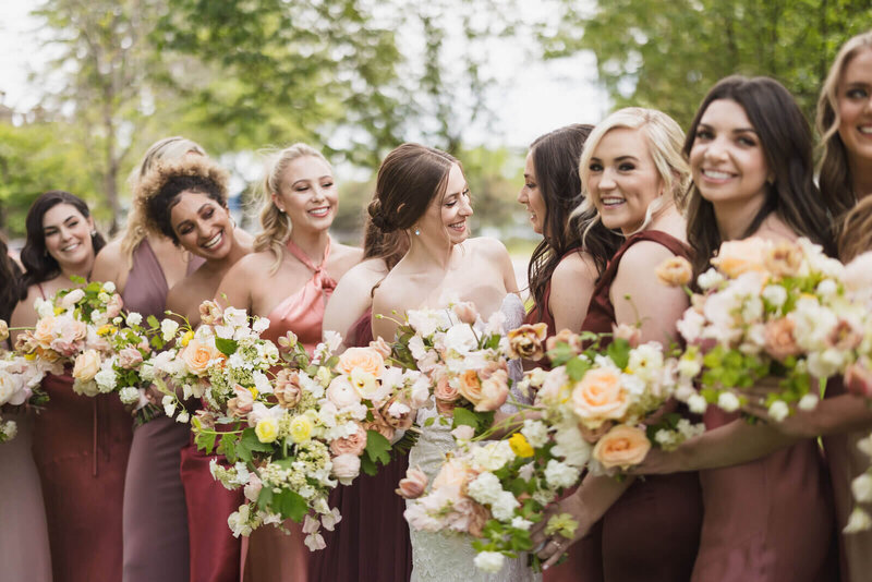 Bridal party holding flowers by wedding planners in chicago