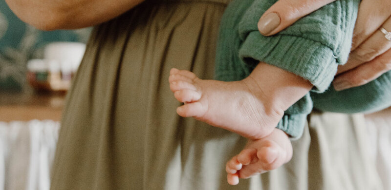 Leslie holding her little one