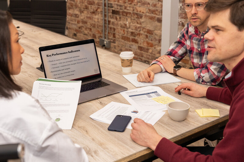 details of documents and powerpoint presentation on laptop during a business meeting and discussion Atlanta Brand Photographer