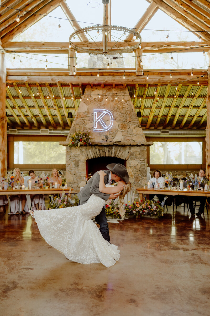 bride and groom dip kissing at their first dance