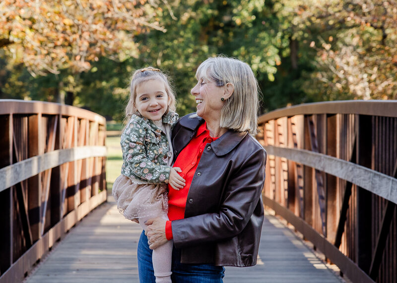 Grandparent and grandchild hugging in a NJ park.