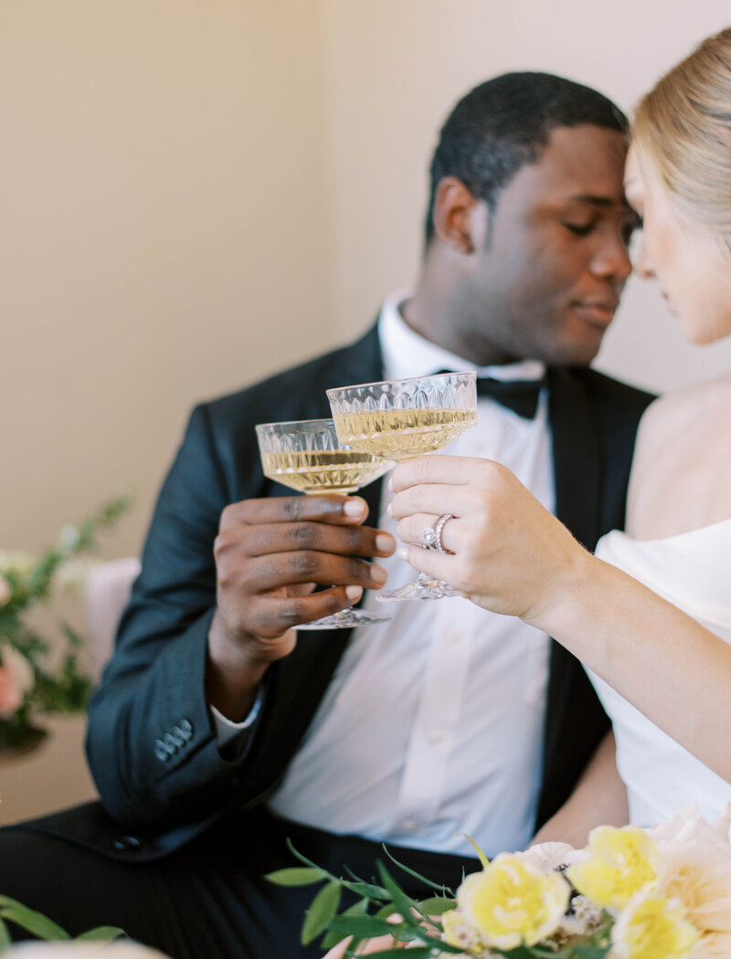 bride and groom toasting champagne on wedding day at hotel zamora in Florida