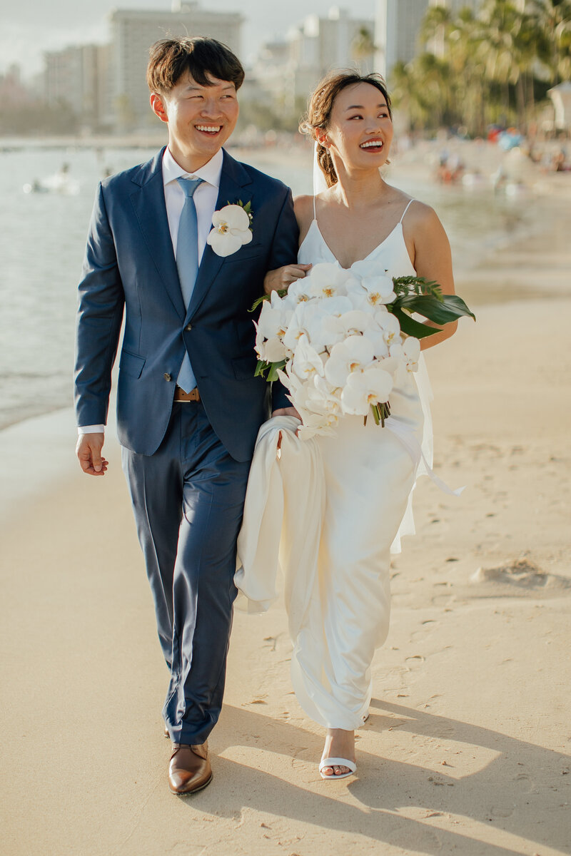 bride & groom walking down aisle smiling