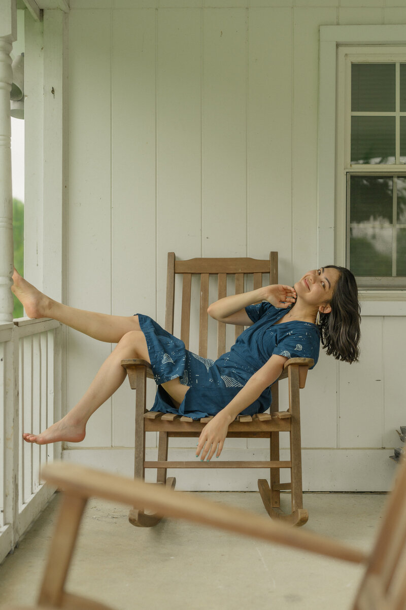 Mary Andrikus, sitting on the ground in Kentucky