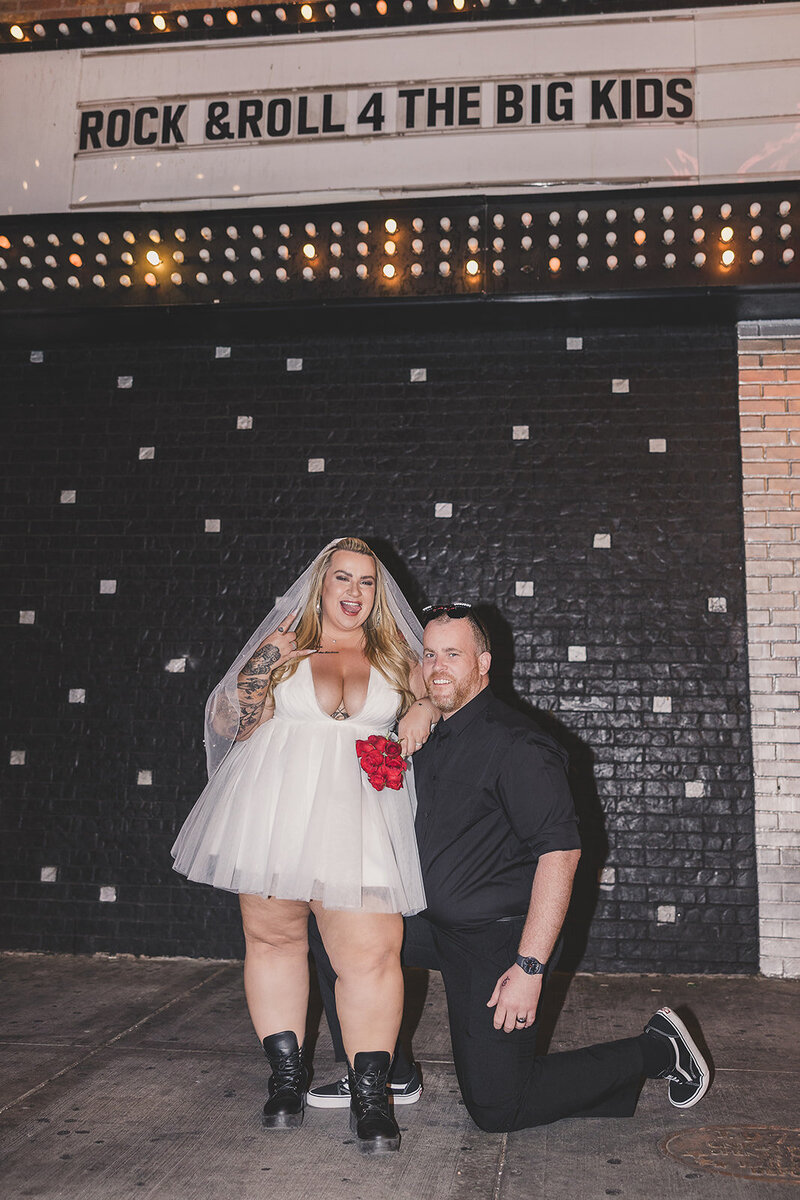bride and groom pose for photos after elopement ceremony in las vegas