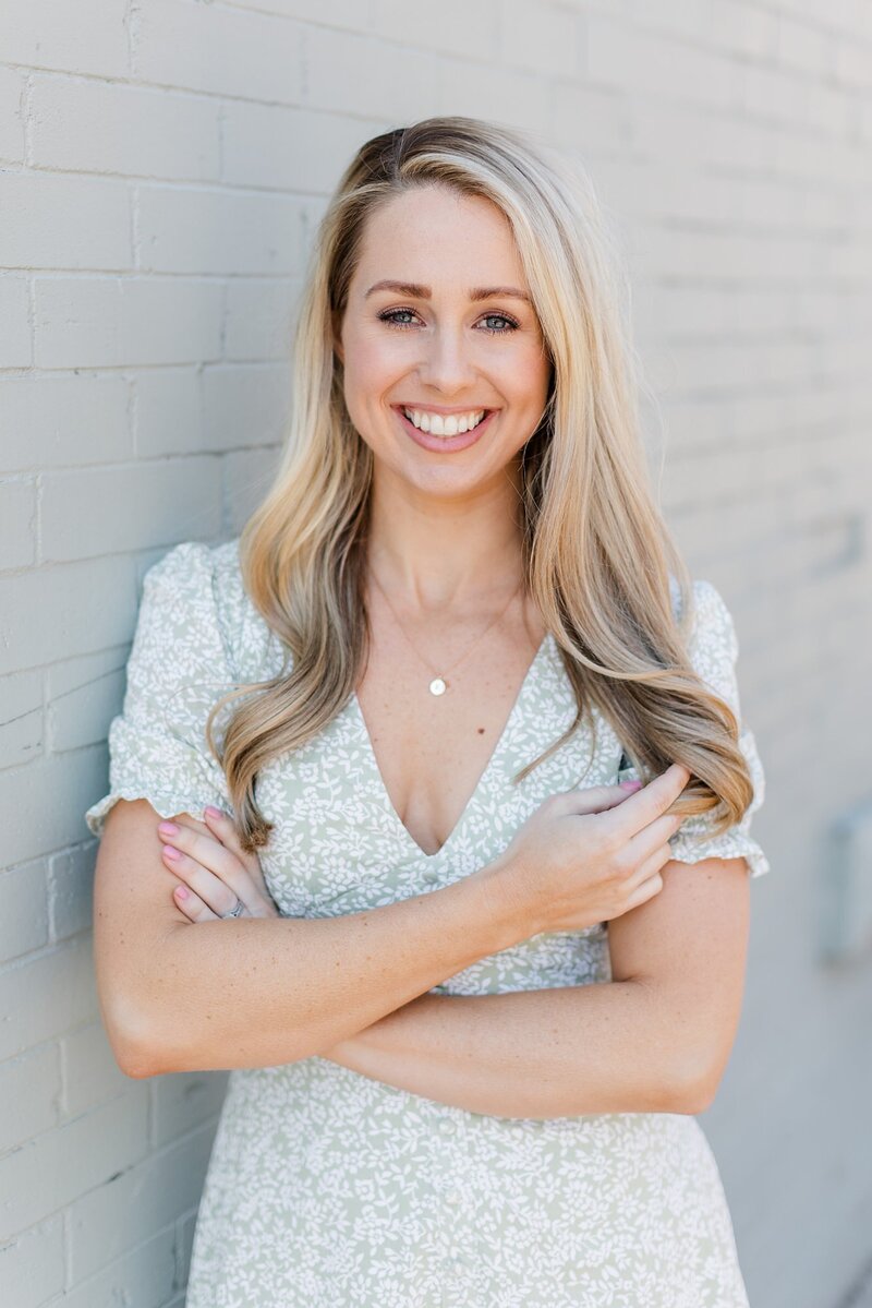 Headshot of a woman with her arms crossed