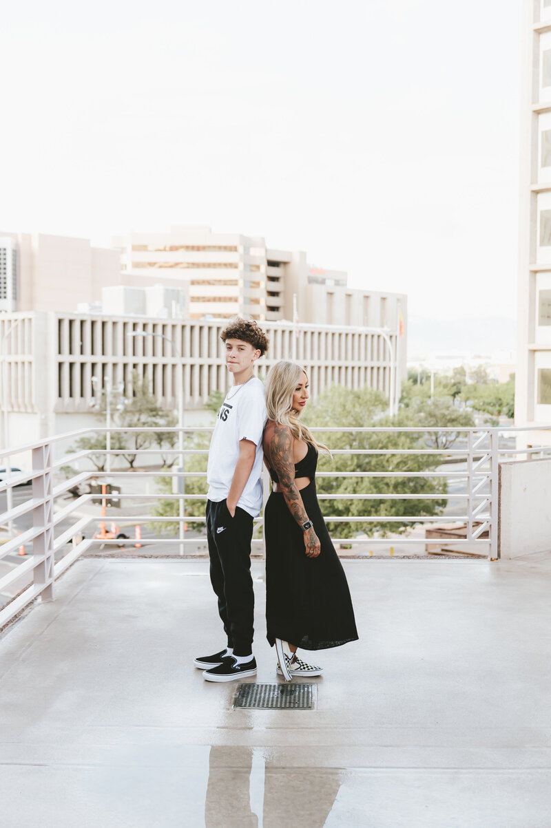 Mother to be holding flowers on her tummy