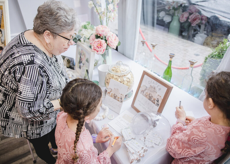 Guests play baby shower games.