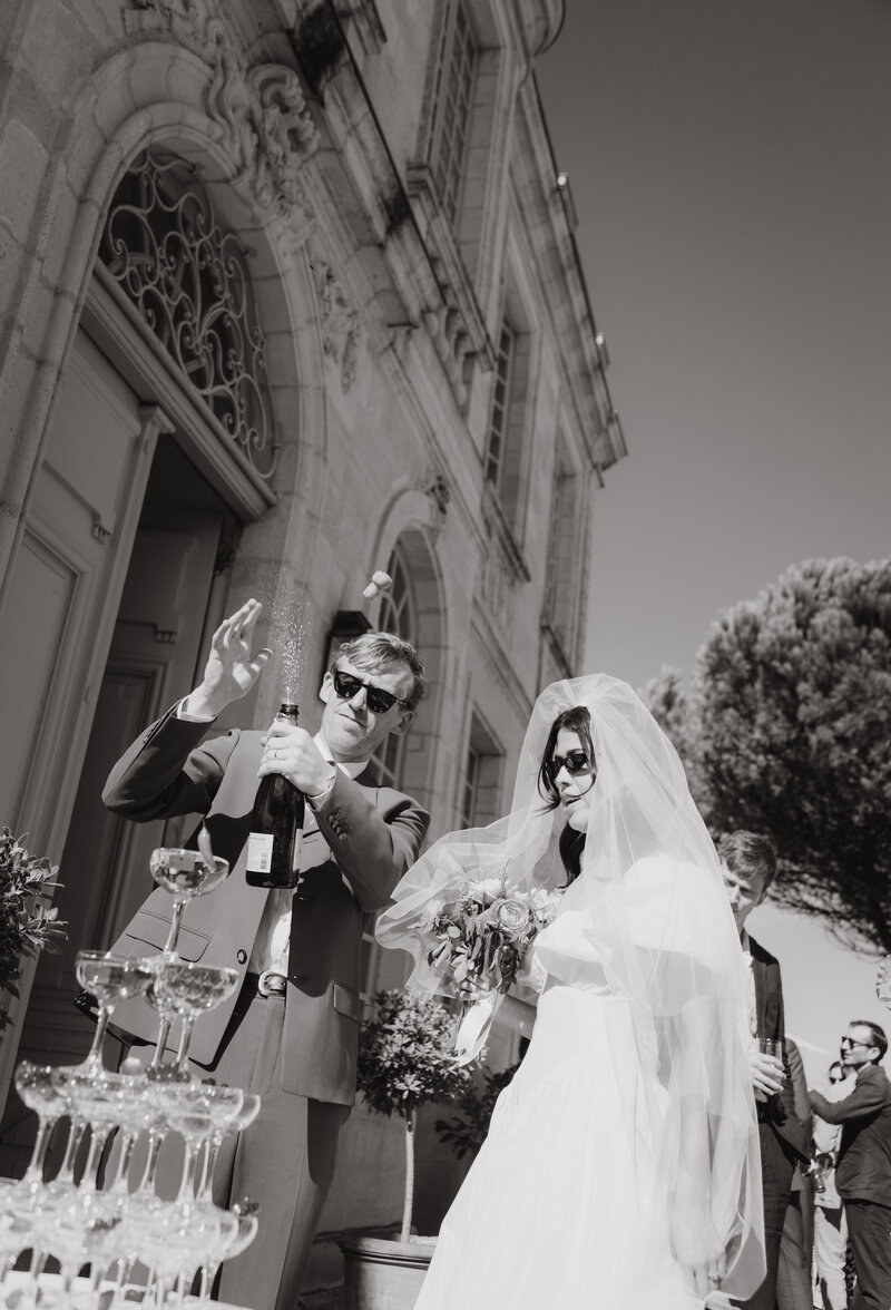 Couple cutting the cake at their wedding in France