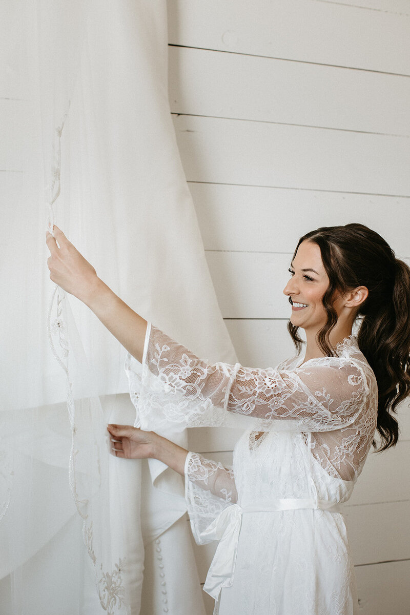 Bride with soft bridal glam and romantic updo in Madison, WI. Wedding hair and makeup services.
