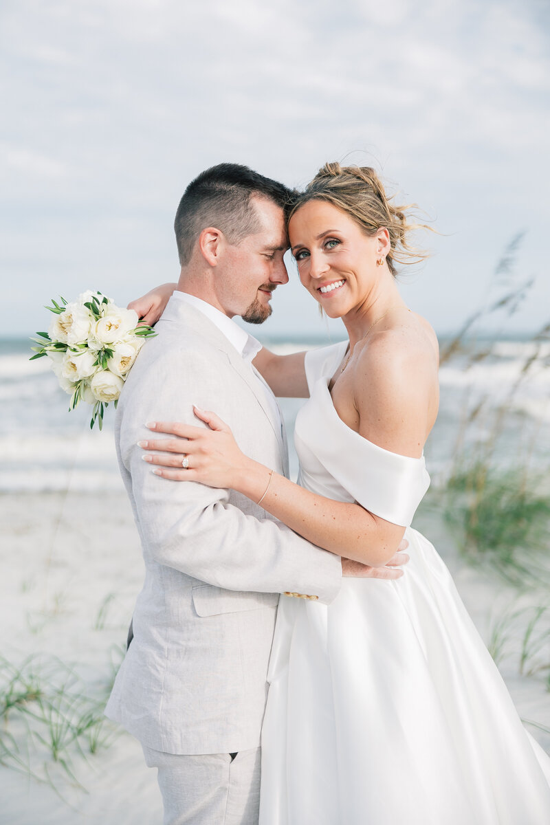 Omni Hilton Head, SC Oceanfront Wedding Venue | Bride And Groom Embracing At The Beach