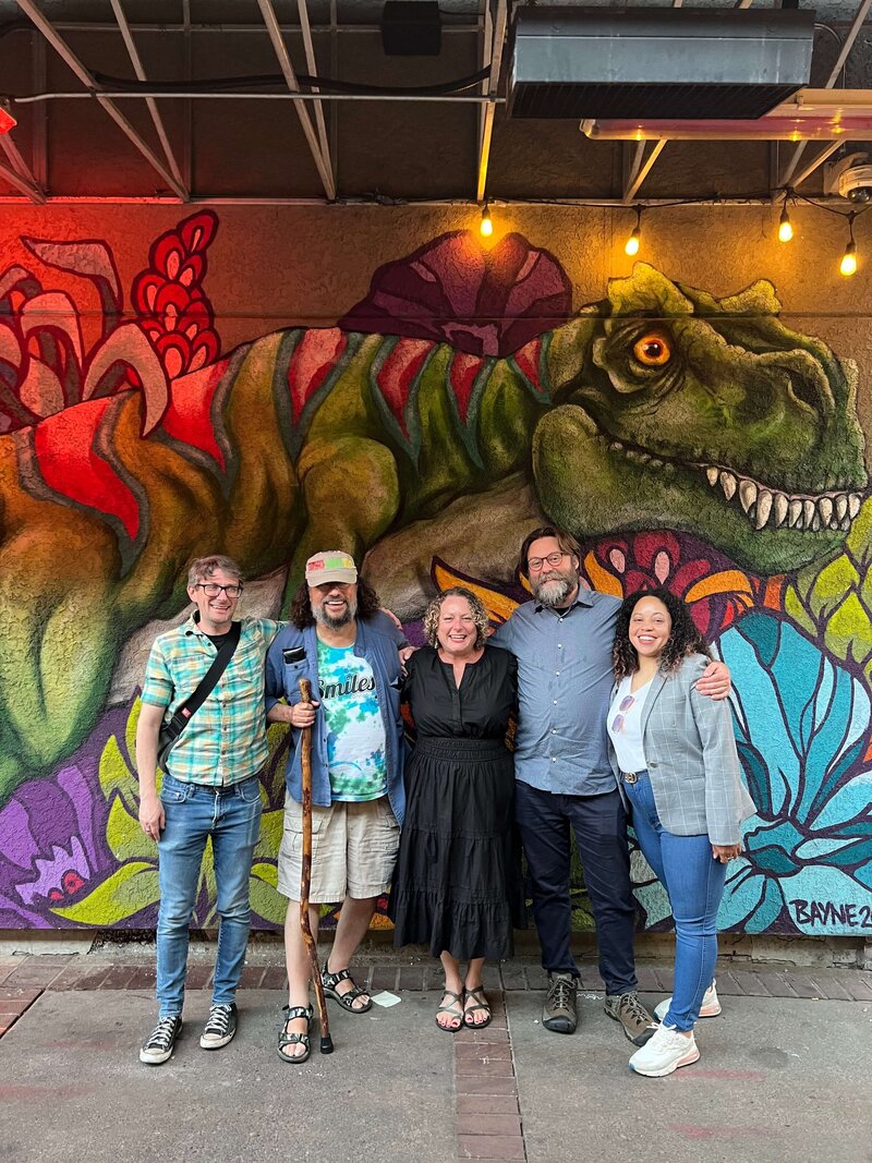 A group of Oregon Cannabis law attorneys smile together, representing their supportive community.