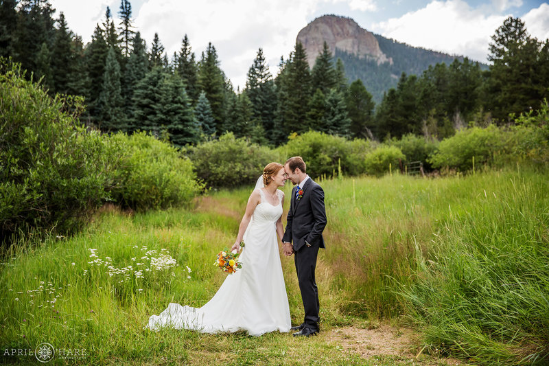 Lion's Head Rock Cliff Backdrop for a Wedding Portrait at Mountain View Ranch
