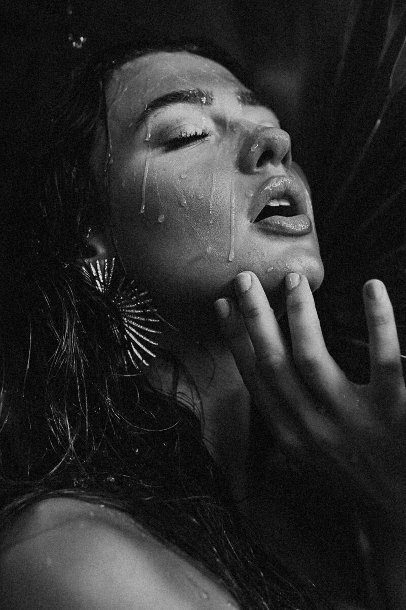 Family Photographer, black and white image of young woman with water dripping down her face and touching her chin