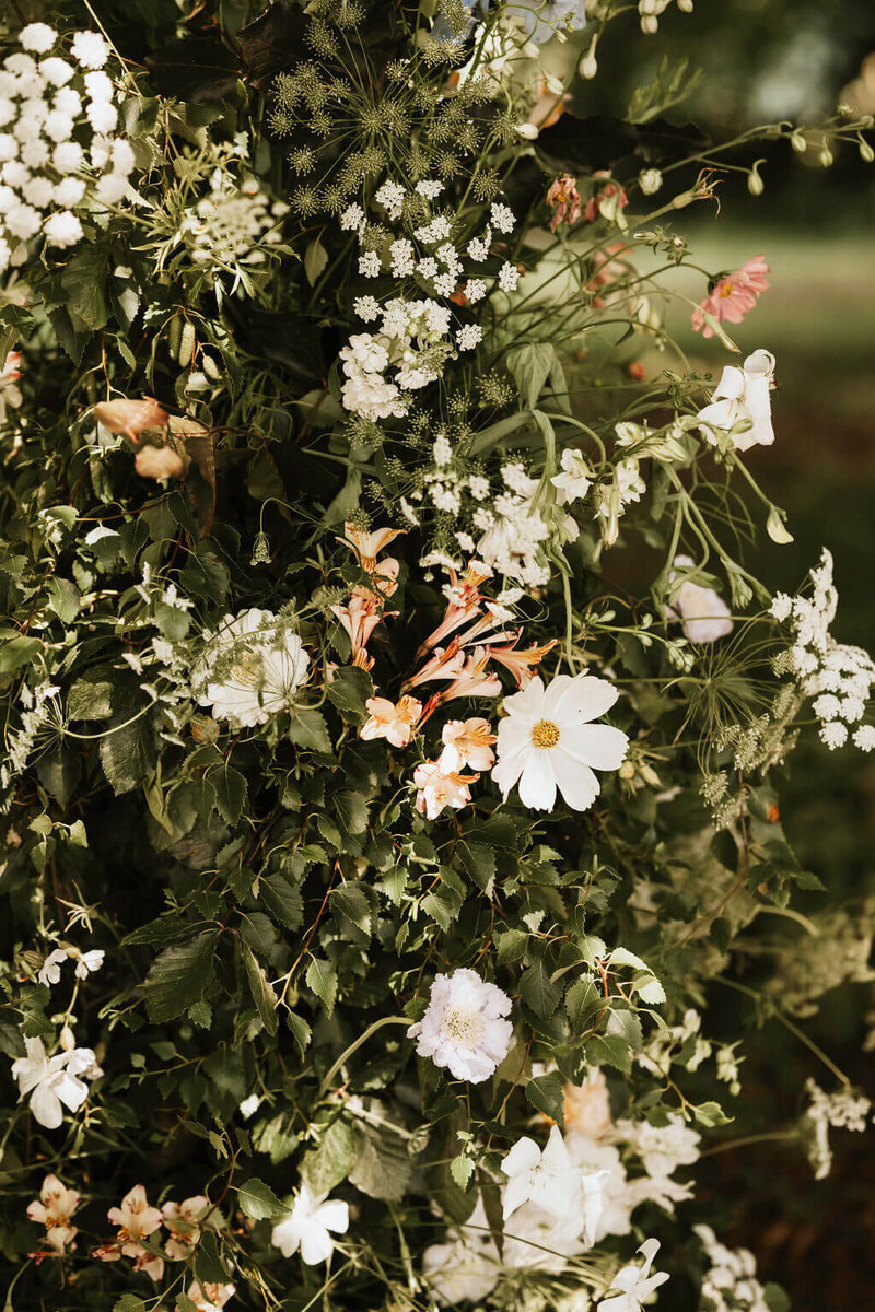 Detailed image of outdoor ceremony at Broadfield Court with British flowers