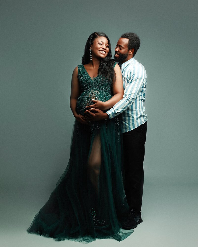 laughing couples maternity photos