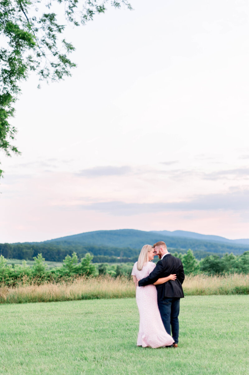 Couple Cuddling at the Foot of Blue Ridge Mountains