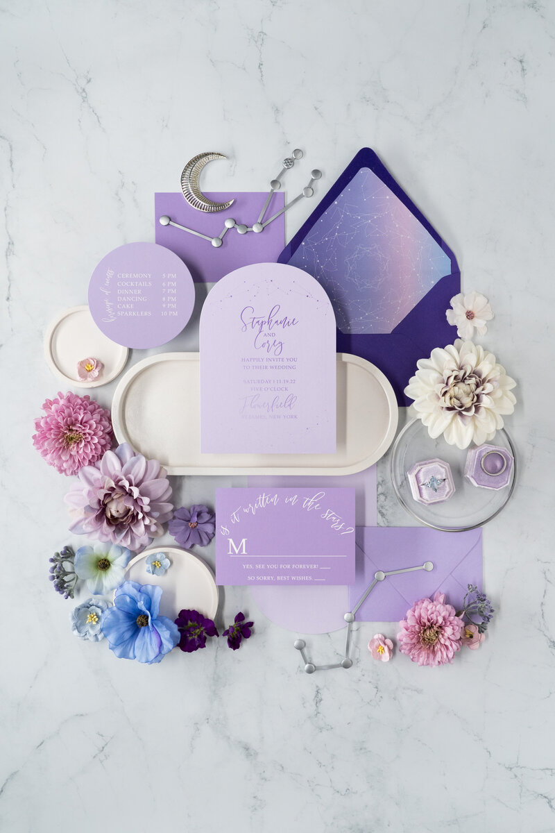 A retro themed wedding invitation suite with record place cards.