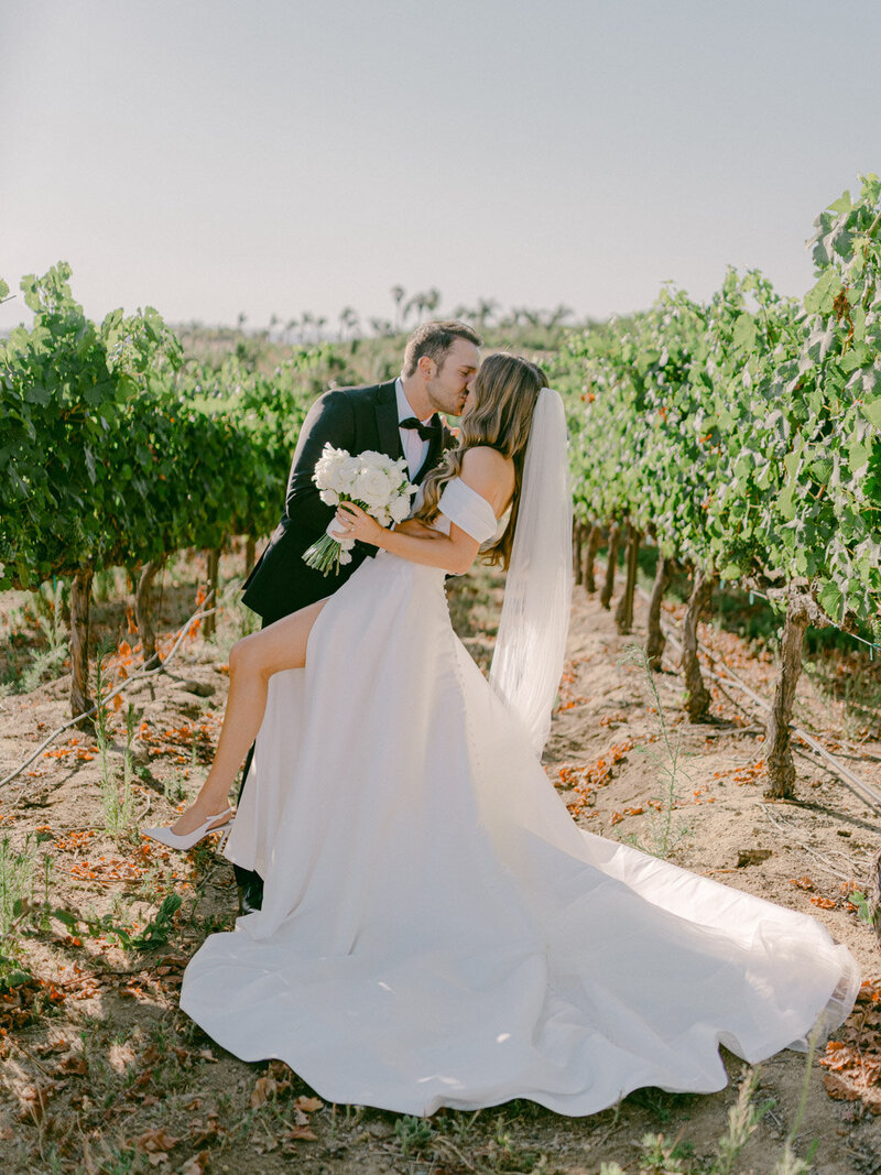 In the golden hills of Southern California, Adam and Bianca’s destination wedding unfolded with cinematic elegance at the renowned Falkner Winery—an estate where vines meet timeless vows. Captured through the refined lens of Michael Asmussen, an internationally recognized destination wedding photographer known for his editorial style and luxury storytelling, this celebration blended San Diego’s wine country charm with effortless sophistication. From sunlit portraits to curated design moments, every frame tells a story of intention, artistry, and romance. Michael’s work spans the most coveted destinations—Orange County, Palm Desert, Los Angeles, Tokyo, Las Vegas, Seoul, and beyond—crafted for modern couples who desire more than memories: they seek legacy.