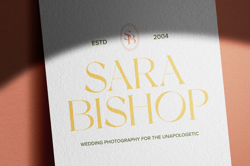business card with sara bishop written in the middle and a logo on top