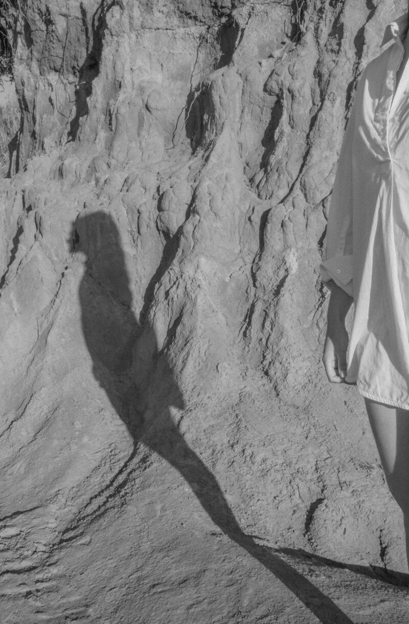 woman standing on a rock