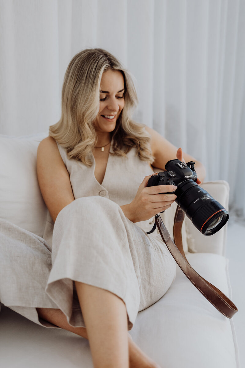 A photograph of lucy jane, the professional christchurch photographer who specializes in newborn, maternity and family photography