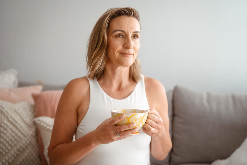Emma Ritchie holding a hot cup of tea