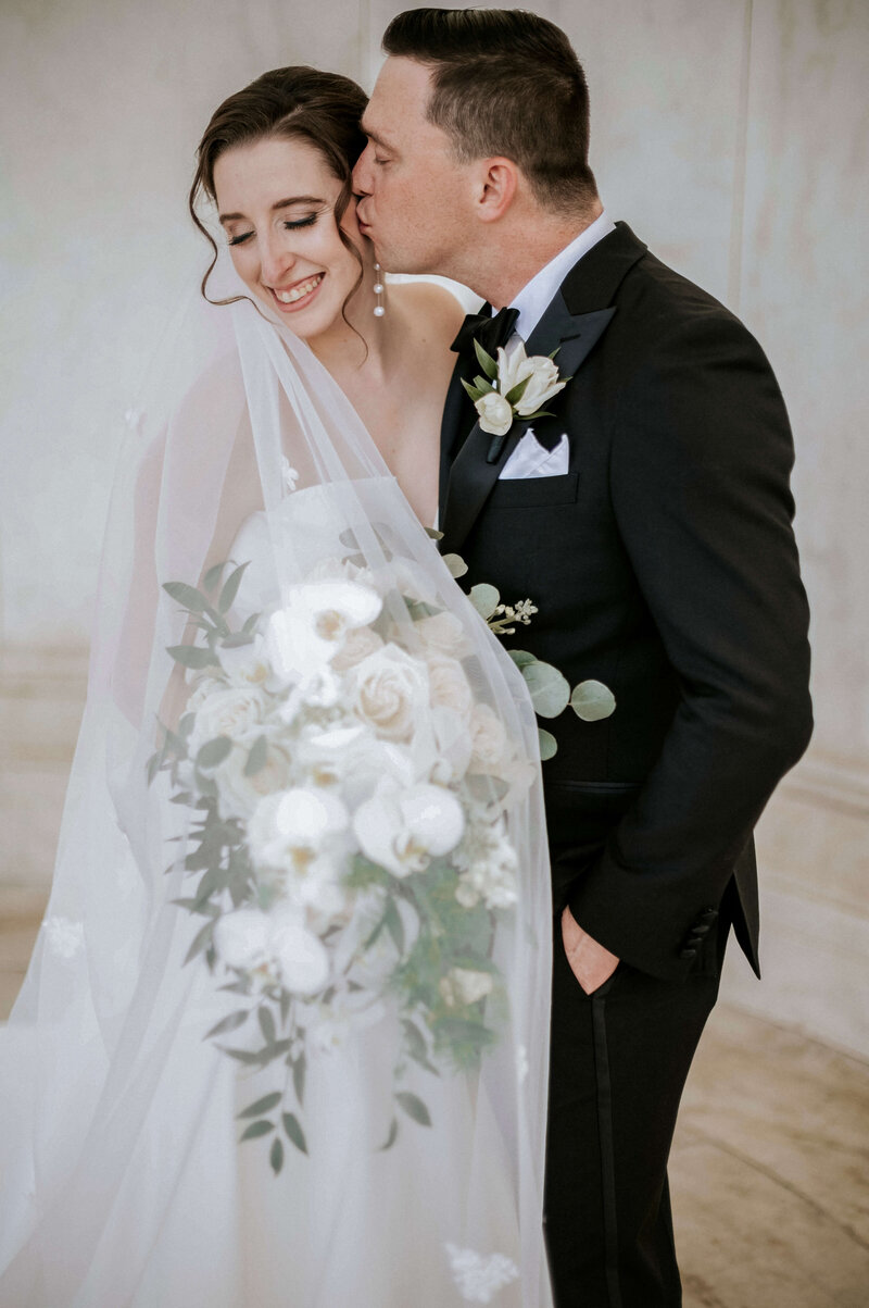 stylish-newlyweds-kissing