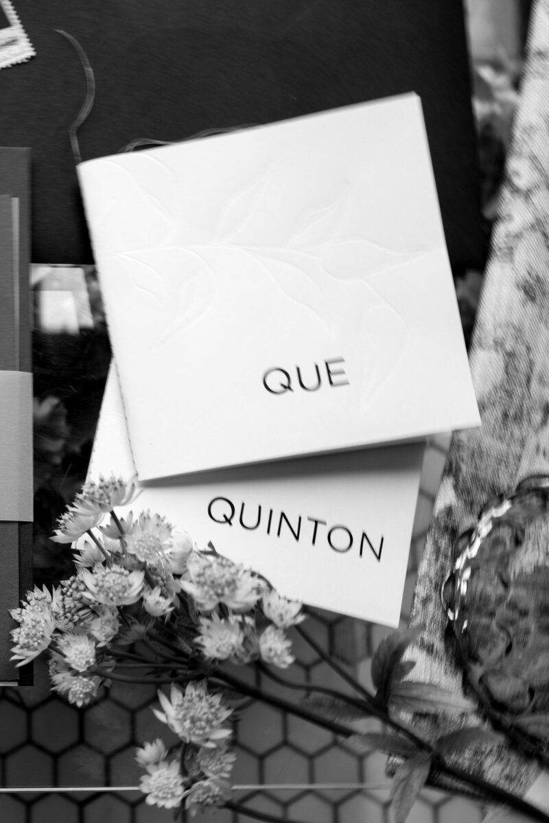 LGBT wedding vow books surrounded by florals Q Jancola