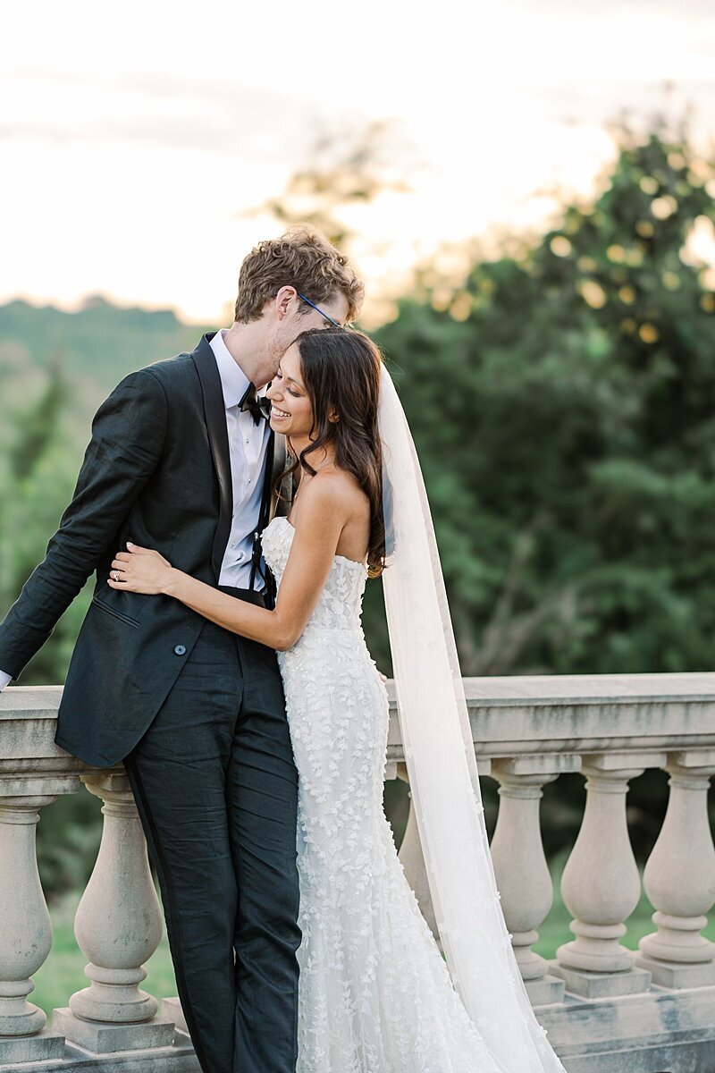 estate-at-river-run-wedding-romantic-portrait-couple-at-sunset-by-river