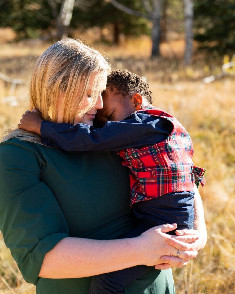 mom holding son