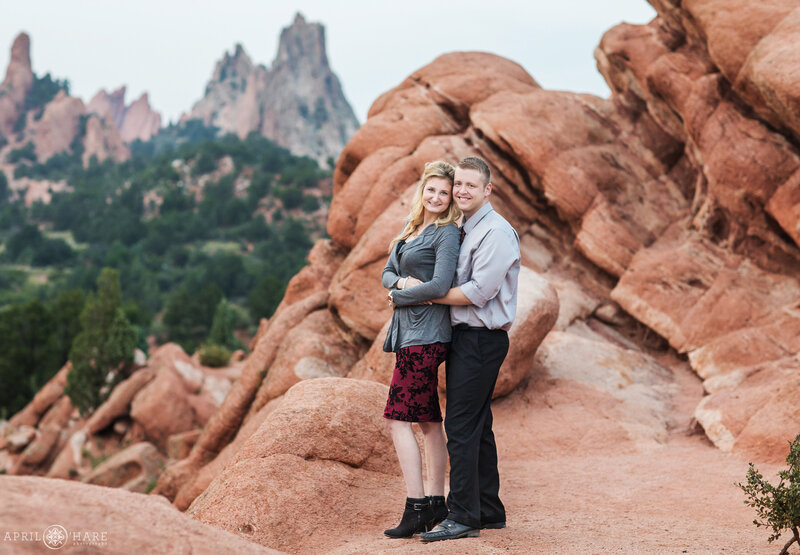 Couple photographed on a hazy day at Garden of the Gods' High Point area in Colorado Springs