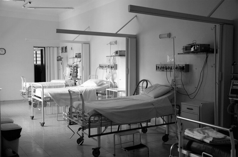 black and white empty beds