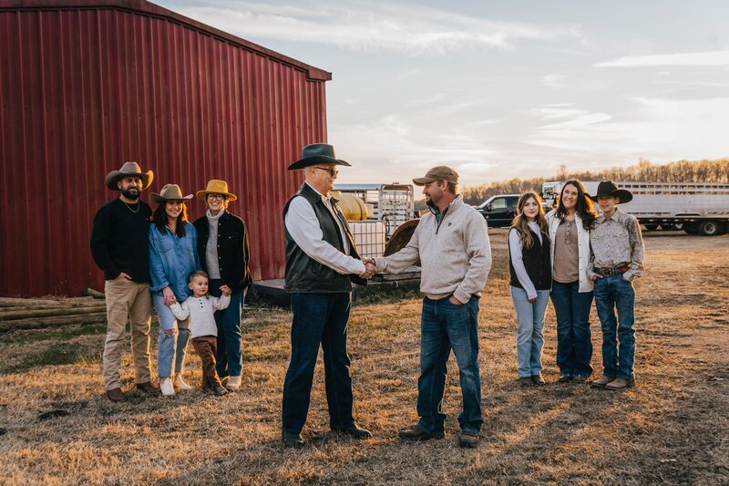 Black Hereford breeders shaking hands
