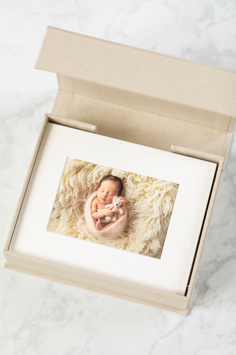matter print of newborn in a linen box