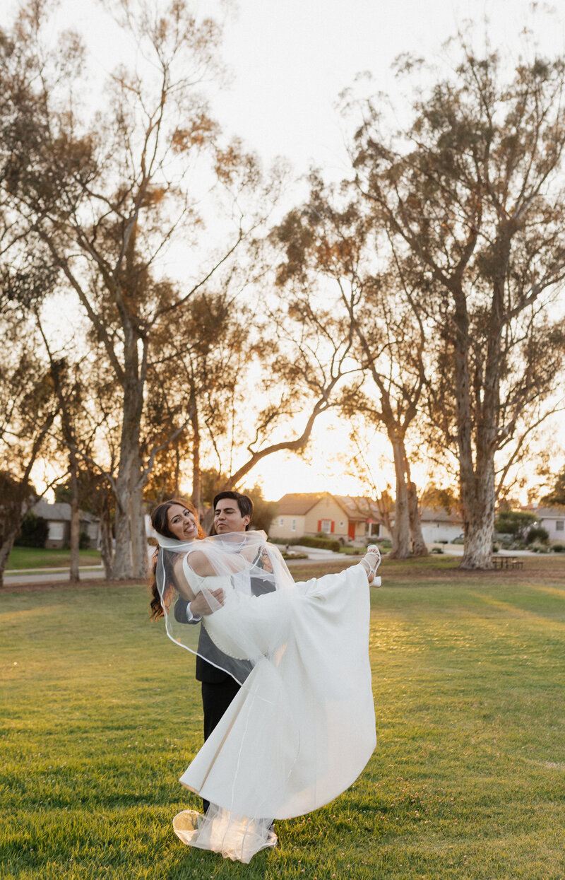 couple laughing together in field