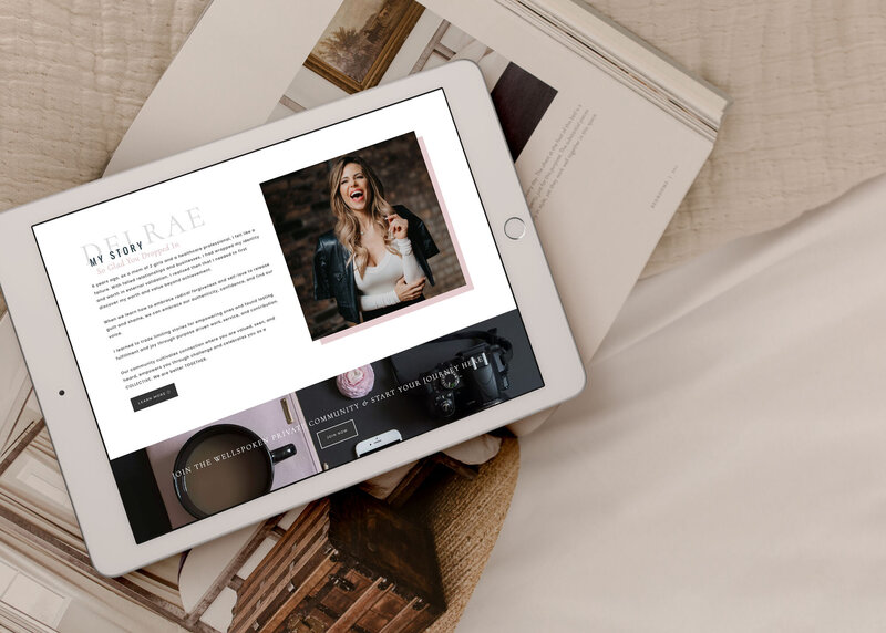iPad displaying custom website layout over brand magazines for service-based business design phase
