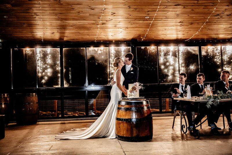 Bride and Groom passionately looking at each other at wedding reception