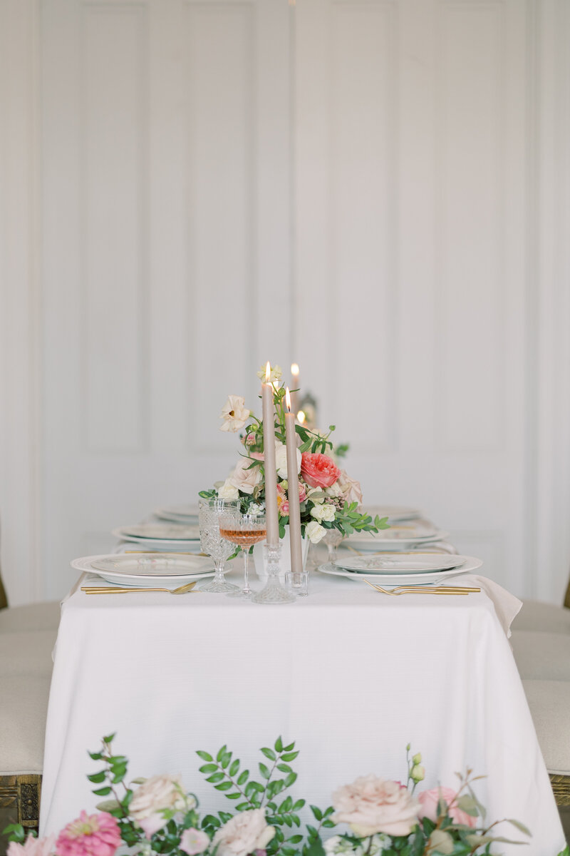 Wedding reception table design featuring candles and lush florals at a North Carolina venue